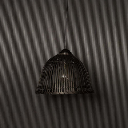 Elegant black rattan pendant lamp highlighted on dark background ideal for modern rustic interior styling.