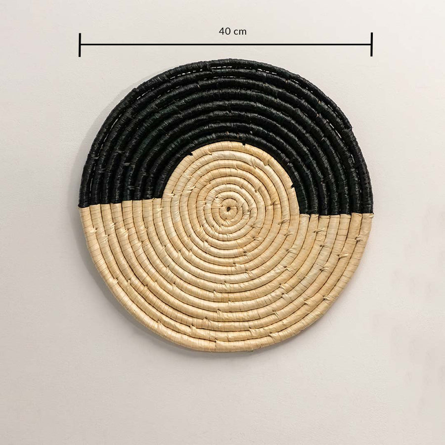 Round woven wall decor with 40cm diameter showing handwoven black and beige spiral design for walls.