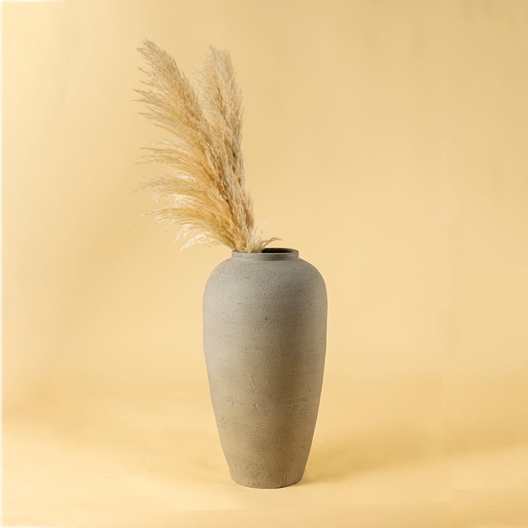 Tall grey textured ceramic vase styled for modern living room decor adding a minimal elegant accent to console tables and corners.
