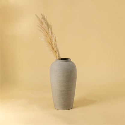 Grey textured ceramic vase styled for modern living room decor with tall elegant shape adding a clean minimal accent to home interiors.