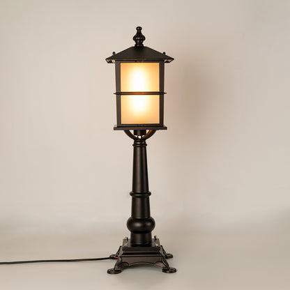 Vintage black outdoor garden light with warm glowing panels for luxury exterior decor styling use.
