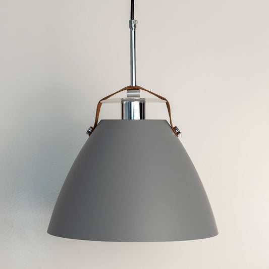 Grey pendant light off white background featuring matte conical shade and sleek metal rod with leather strap detail.