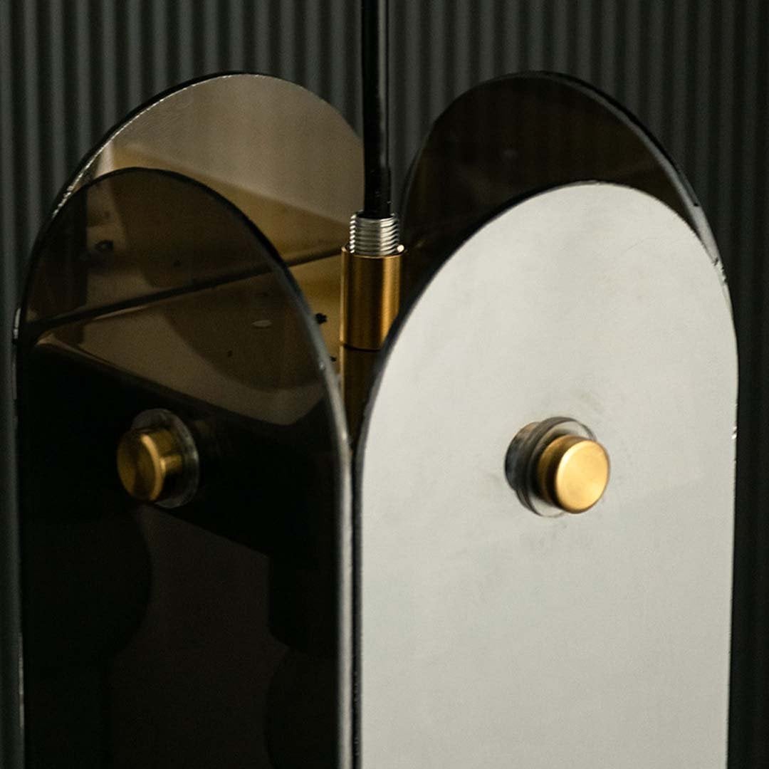 Closeup view capturing smoked glass panels and gold frame details highlighting premium finish smooth curves and high quality craftsmanship.