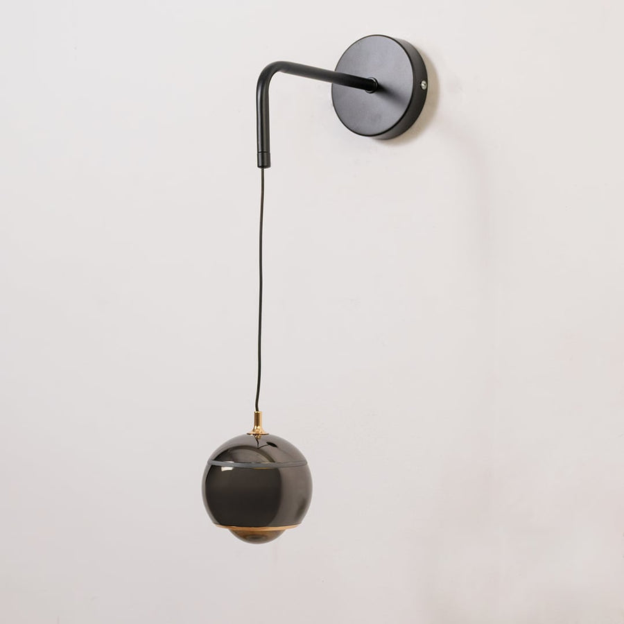 Table lamp look wall light shown with the light off on a white background featuring a matte arm and glossy shade for modern interior decor.