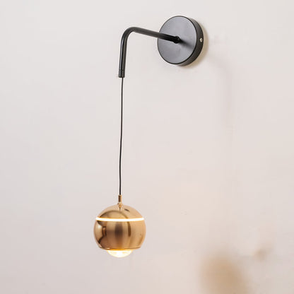 Spherical gold metal wall light turned on shown on white background for modern home and office decor.