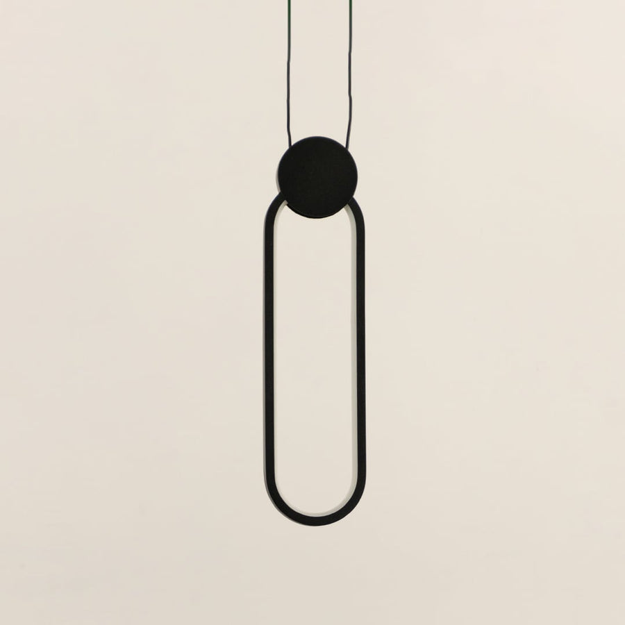 Modern slim oval black LED pendant light displayed off on white background for stylish interior decoration.