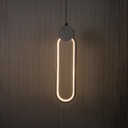 Modern slim oval black LED pendant light glowing brightly on black background ideal for elegant home interiors.