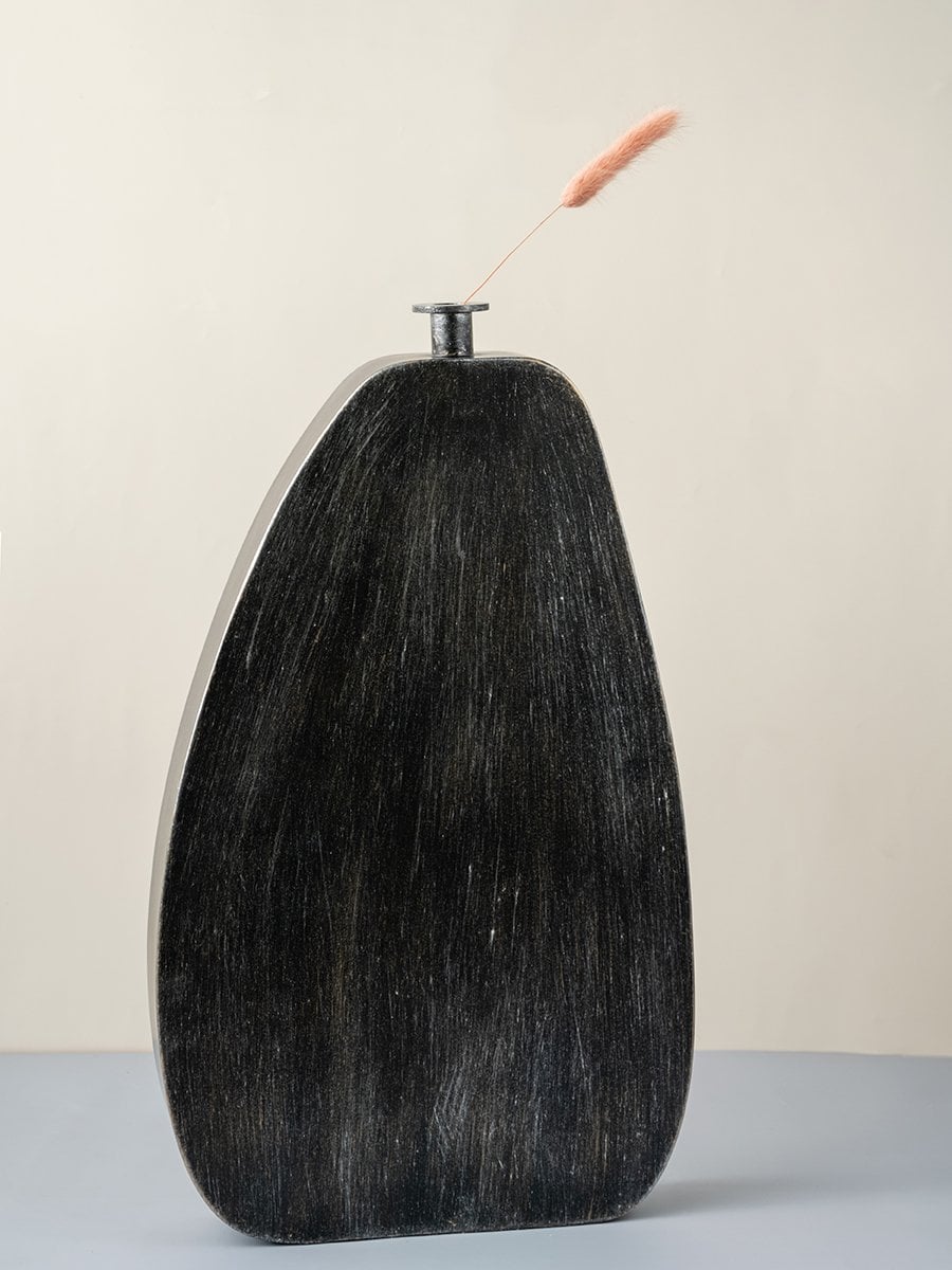 Tall black wooden vase with textured matte finish modern decorative accent for stylish home interior decor.