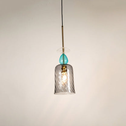 Elegant glass pendant light with glowing grey glass shade and blue top detail shining beautifully against a clean white background.