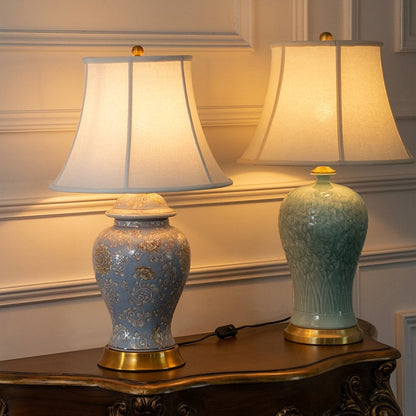 Blue and green ceramic table lamps with warm ambient glow for elegant modern home lighting decor styling.