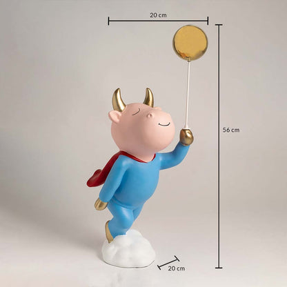 A full measurement view of the superhero figurine showing its 56 cm height 20 cm width and 20 cm base depth displayed clearly with the golden balloon held high above.