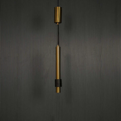 Stylish gold hanging pendant lamp turned off with matte black accent highlighted on dark background for luxury interiors.