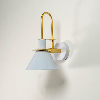 White and gold wall light with sleek conical shade displayed on white wall background for minimalist interiors.