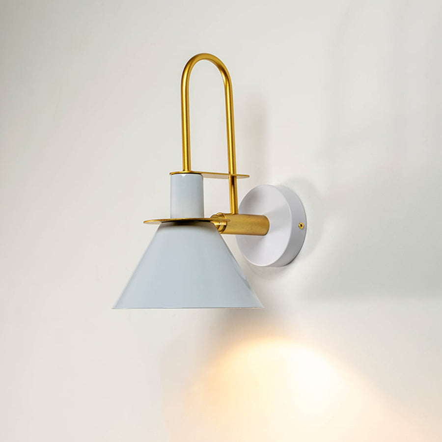 White and gold wall light glowing warmly against white wall ideal for bedroom or hallway modern lighting decor.