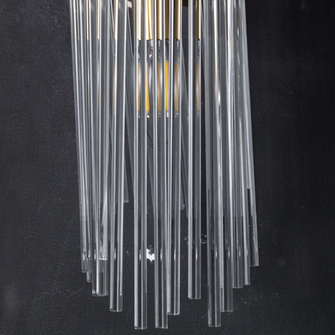 Closeup view of the metal and clear glass rod wall light highlighting its refined detailing and premium craftsmanship for interior styling.