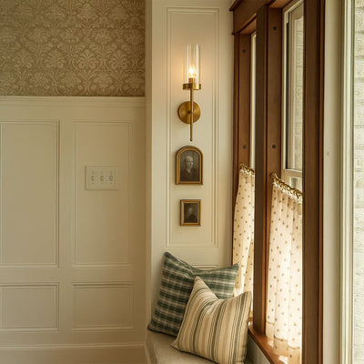 Lifestyle image of modern cylindrical glass golden lighting fixture for elegant room decor styling with sleek finish.