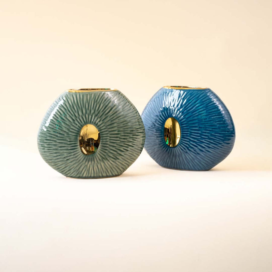 Pair of textured green and blue oval vases with gold accents for modern home decor and artistic tabletop styling.