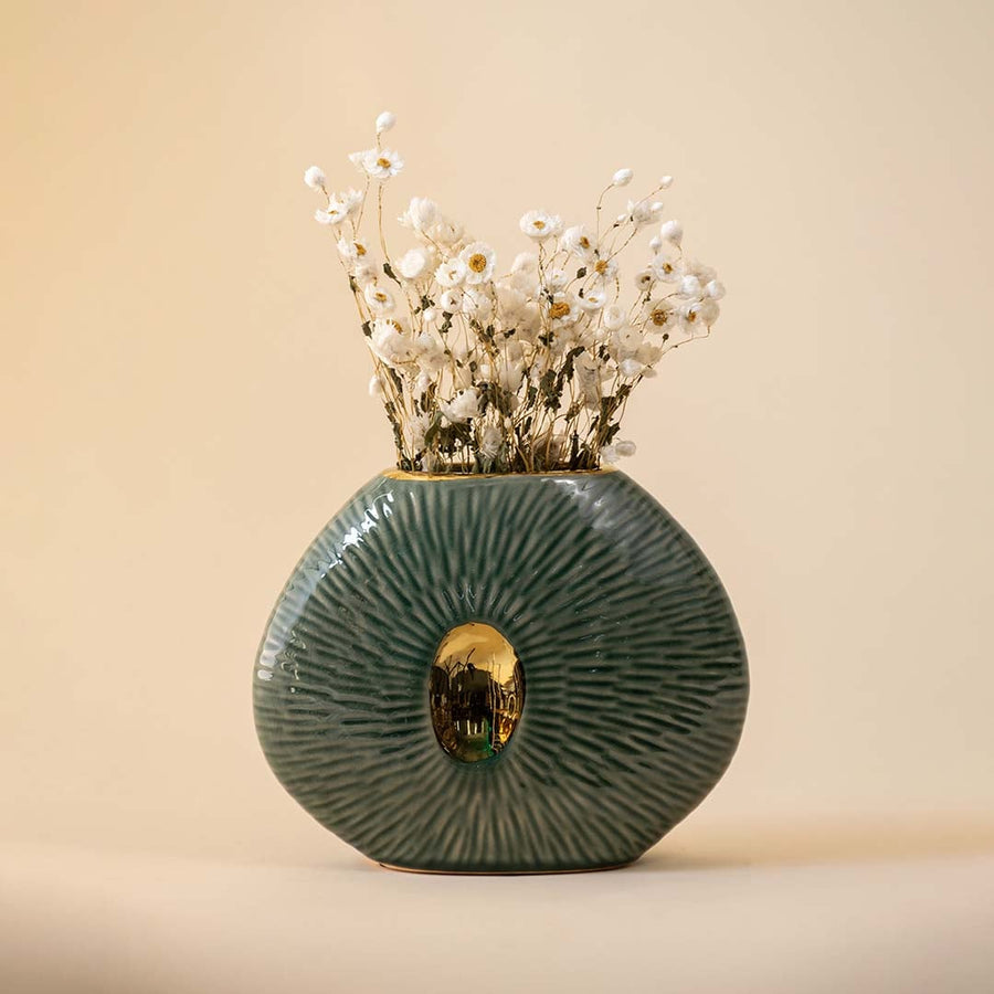Textured green oval vase with gold center accent for artistic home decor and modern shelf display style.