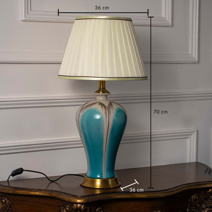 Ceramic table lamp with pleated shade and golden base showing height 70 cm and width 36 cm for detailed product reference.