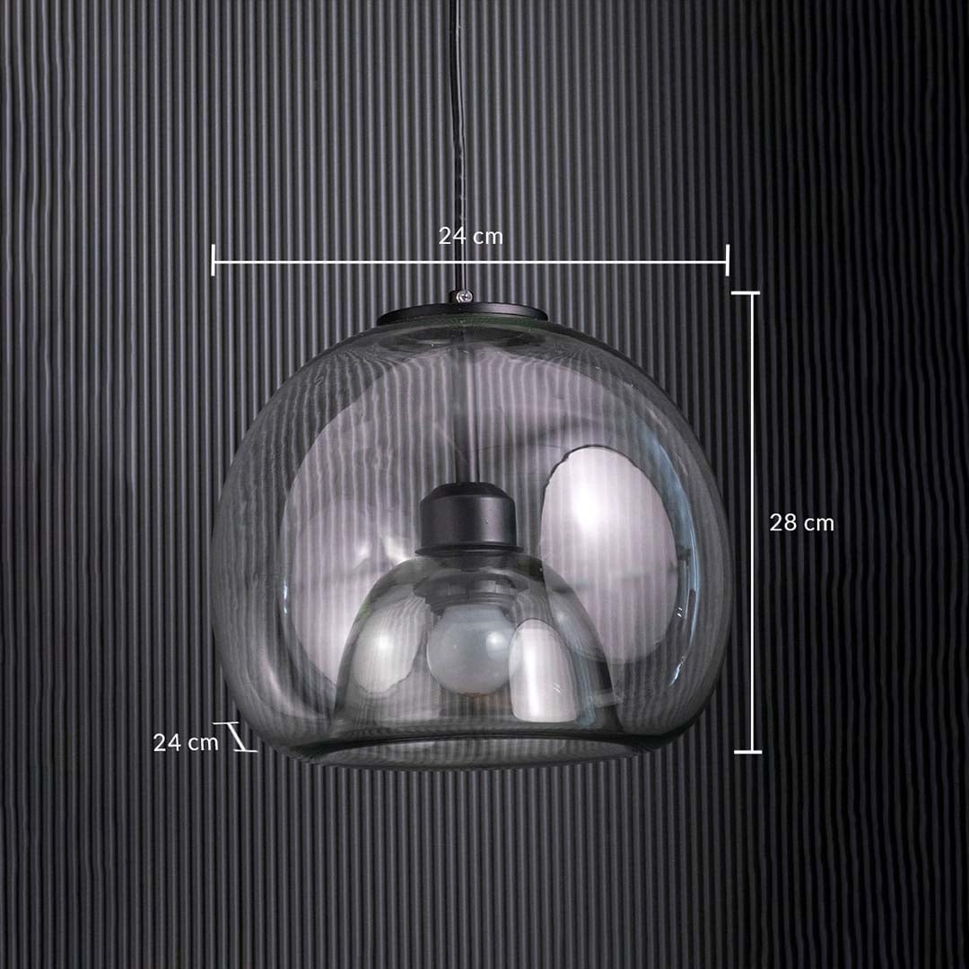 Table lamp with a clear glass dome pendant measuring 24 cm wide and 28 cm tall shown against a dark vertical panel background.