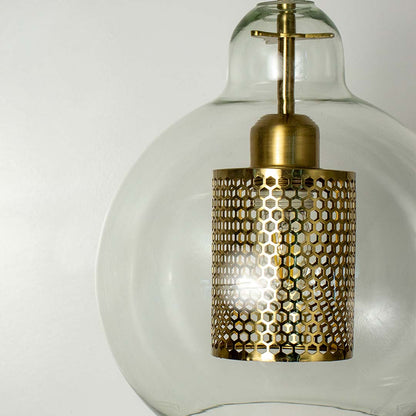 Closeup of glass pendant light with golden mesh inner shade elegant design ceiling lamp for luxury modern home decoration.