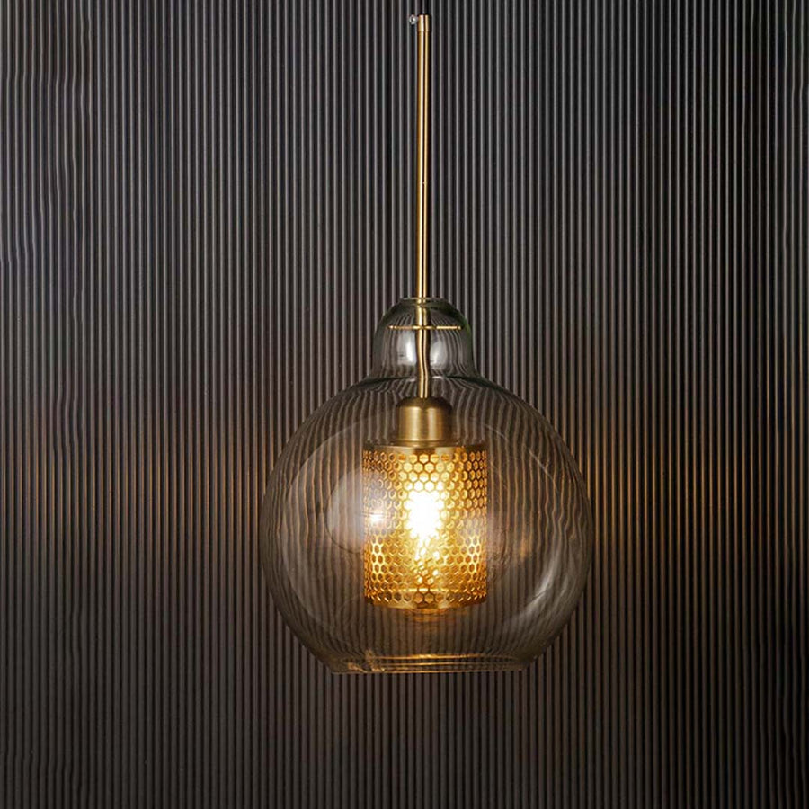 Modern glass pendant lamp glowing warm light with golden mesh detailing luxury hanging ceiling light for living and dining room.