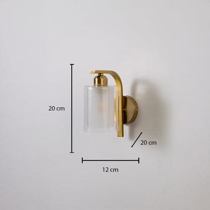 Gold metal wall light with clear glass shade showing 20 cm height 12 cm width and 7 cm projection suitable for modern interior wall lighting.
