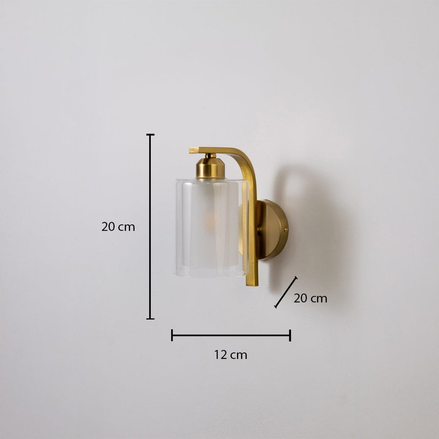 Gold metal wall light with clear glass shade showing 20 cm height 12 cm width and 7 cm projection suitable for modern interior wall lighting.
