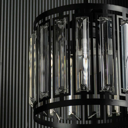 Detailed view of black metal and smoked glass chandelier showcasing refined texture and finish.