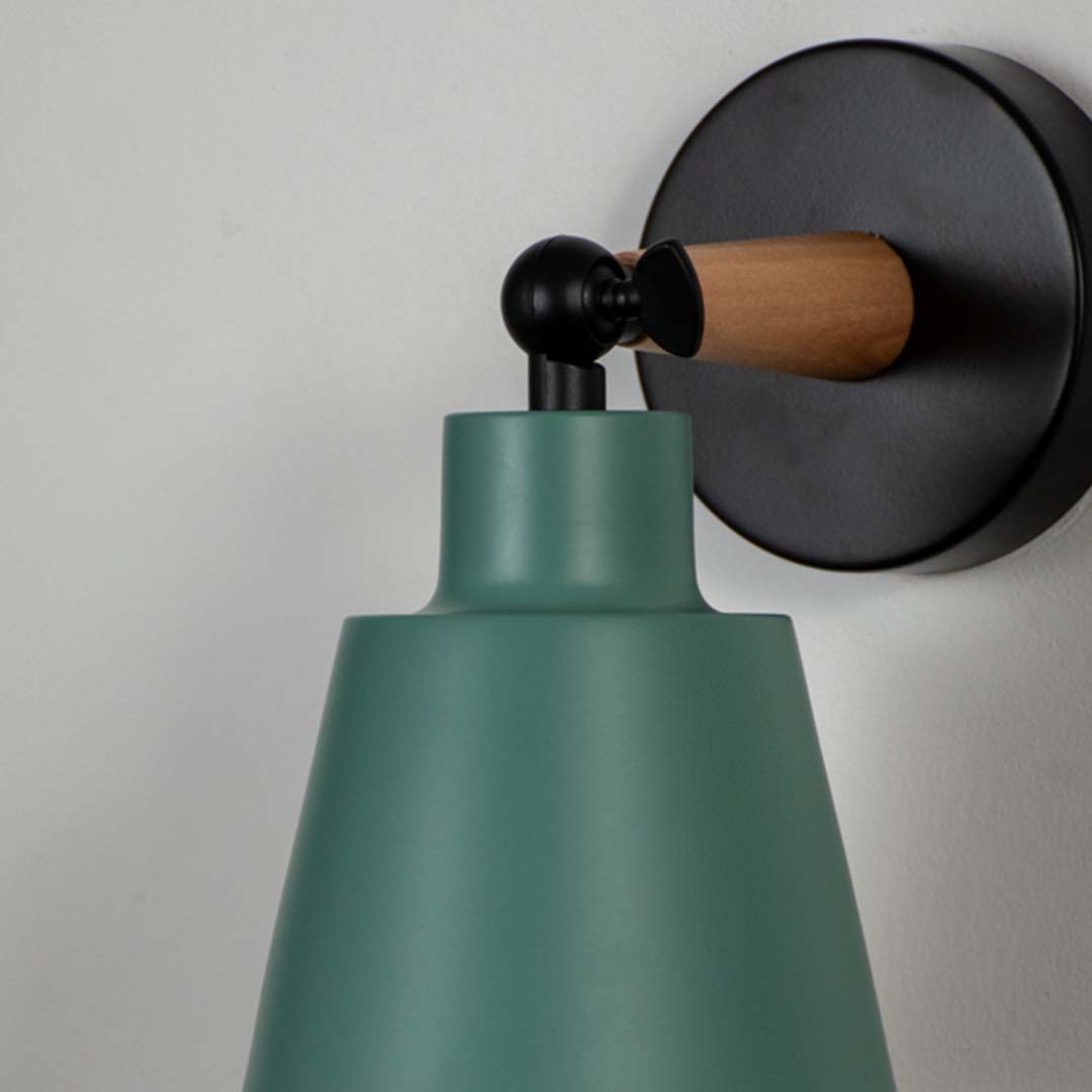 Closeup view of wooden wall sconce with green conical lampshade elegant modern indoor wall light for bedroom kids room and hallway decorative lighting.