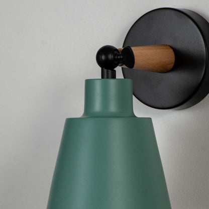 Closeup view of wooden wall sconce with green conical lampshade elegant modern indoor wall light for bedroom kids room and hallway decorative lighting.