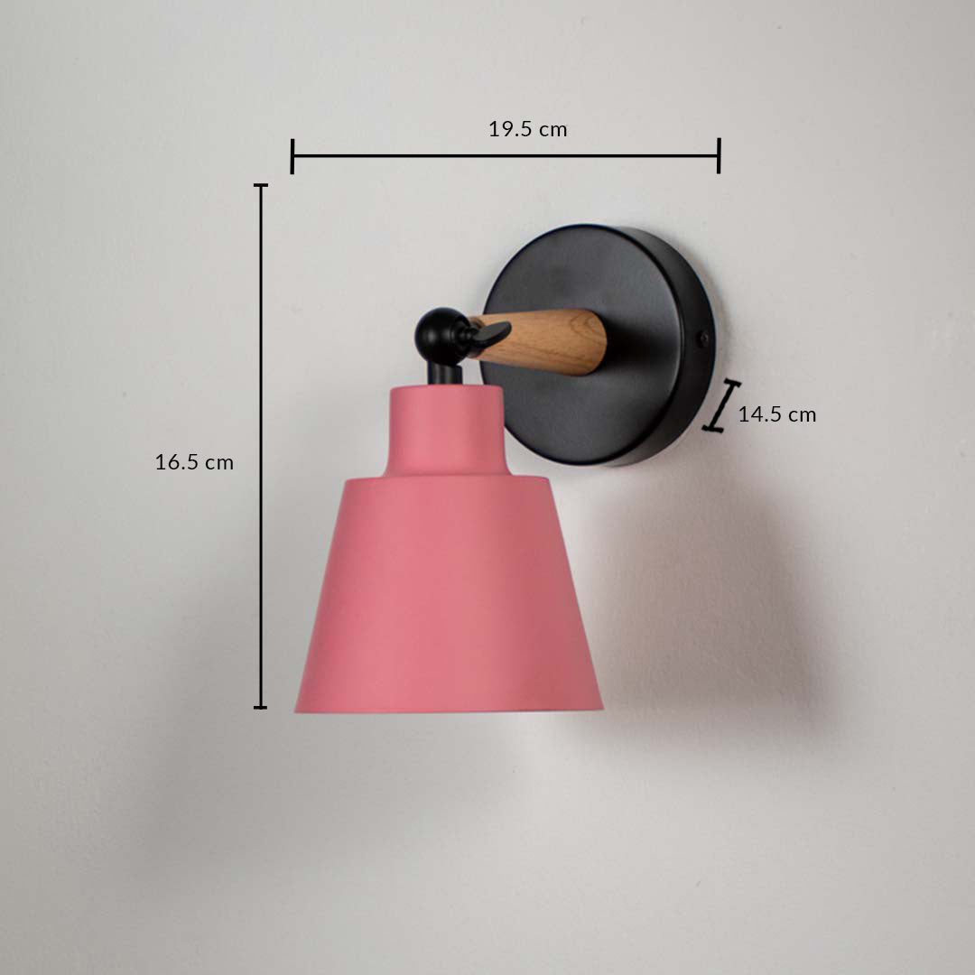 Pink metal wall light with black mount on white background with dimensions modern cone shade design perfect for bedside and living room lighting.
