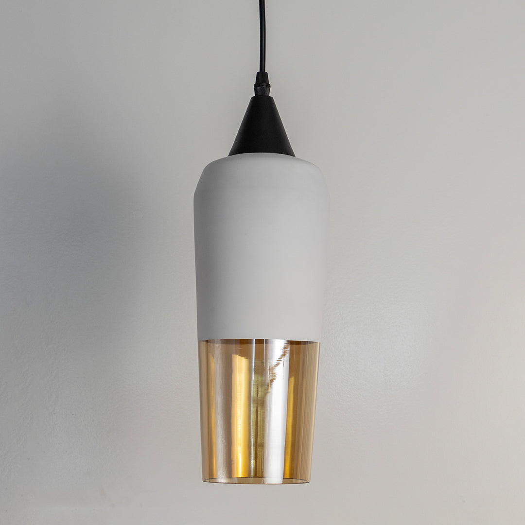 White metal pendant light with gold glass insert crafted for stylish kitchens and dining interiors.