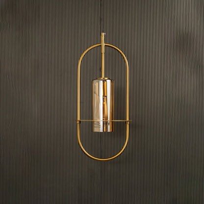 Unlit pendant lamp set against a dark backdrop revealing its modern oval silhouette and subtle metallic sheen.