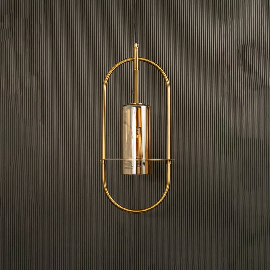 Unlit pendant lamp set against a dark backdrop revealing its modern oval silhouette and subtle metallic sheen.