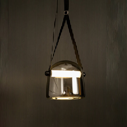 Chrome glass pendant light glowing beautifully on black background ideal for living room or dining space lighting.