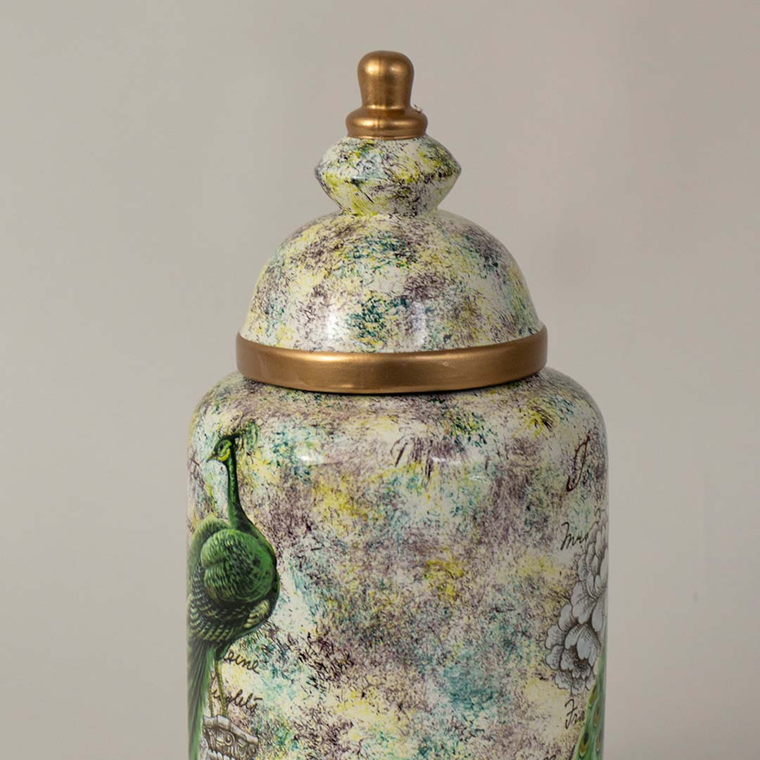 Detailed closeup of ceramic jar showcasing intricate peacock feathers and floral background artistry with glossy golden rim.