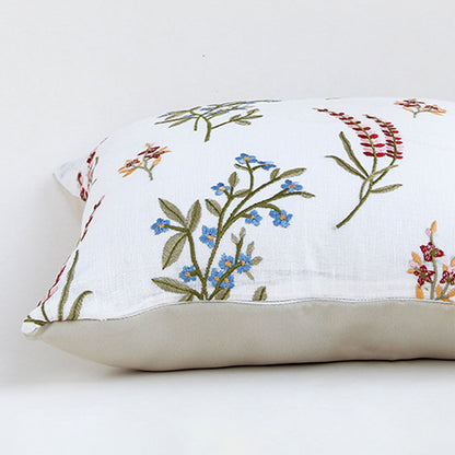 Closeup view of cotton cushion embroidery showing colorful stitched floral patterns and textured fabric details ideal for adding soft charm to home decor.