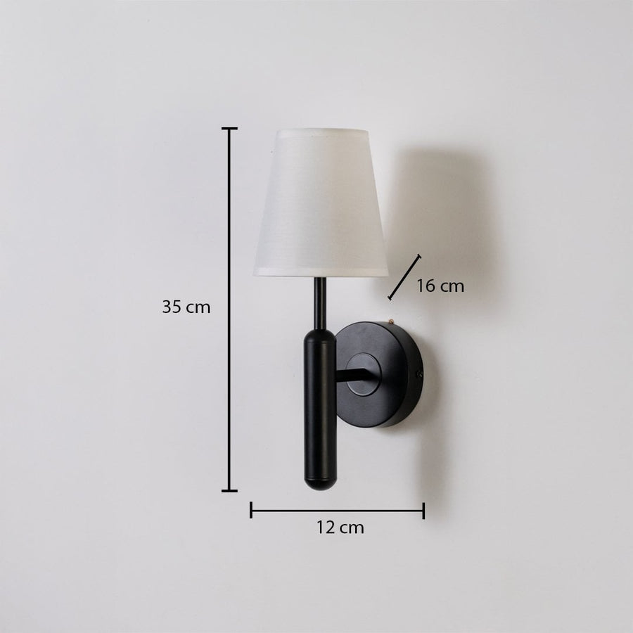 Black metal wall light with white fabric shade shown with 35 cm height 12 cm width and 16 cm depth for accurate modern indoor wall placement.