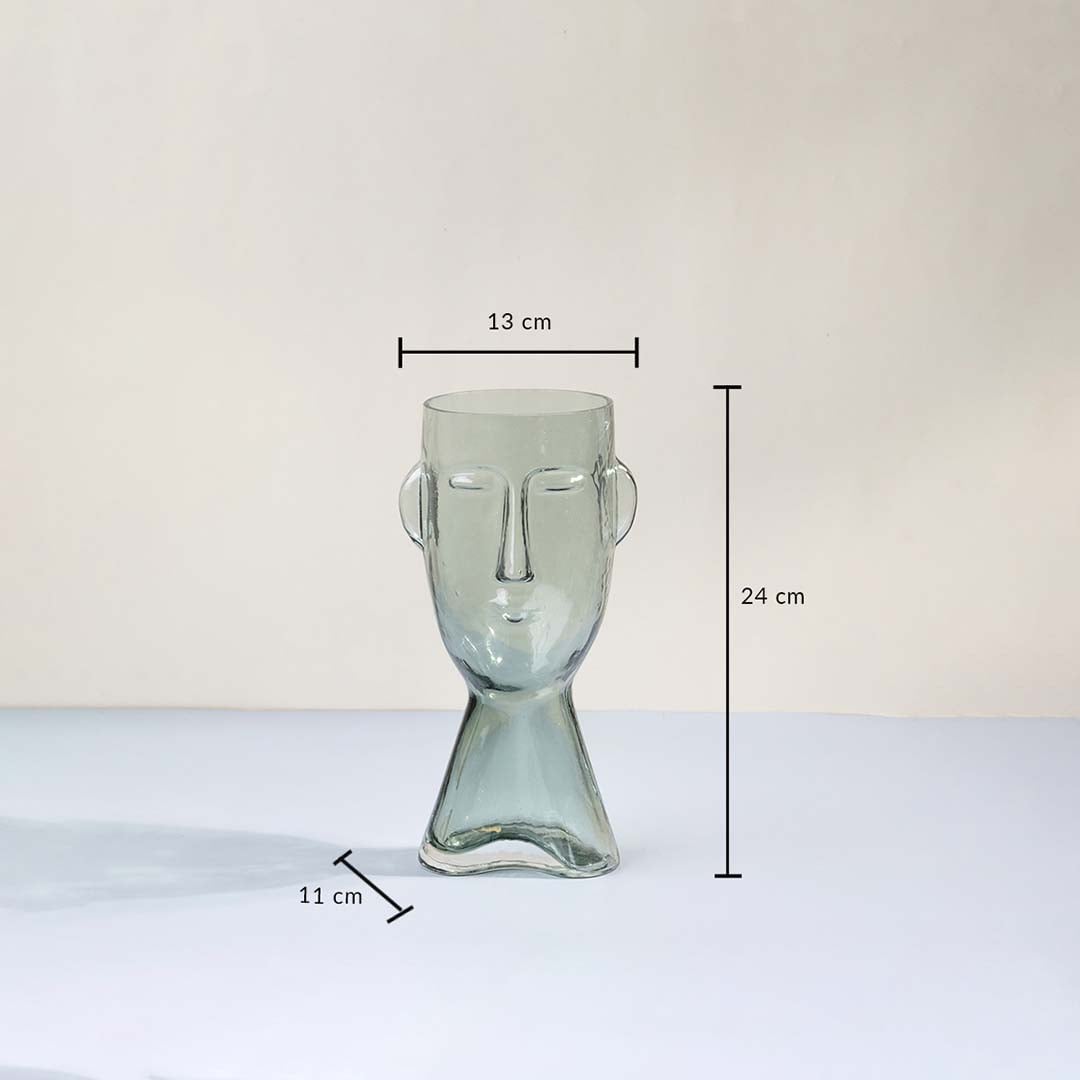Face shaped glass vase modern abstract design transparent finish decorative accent piece with size shown light on white background.