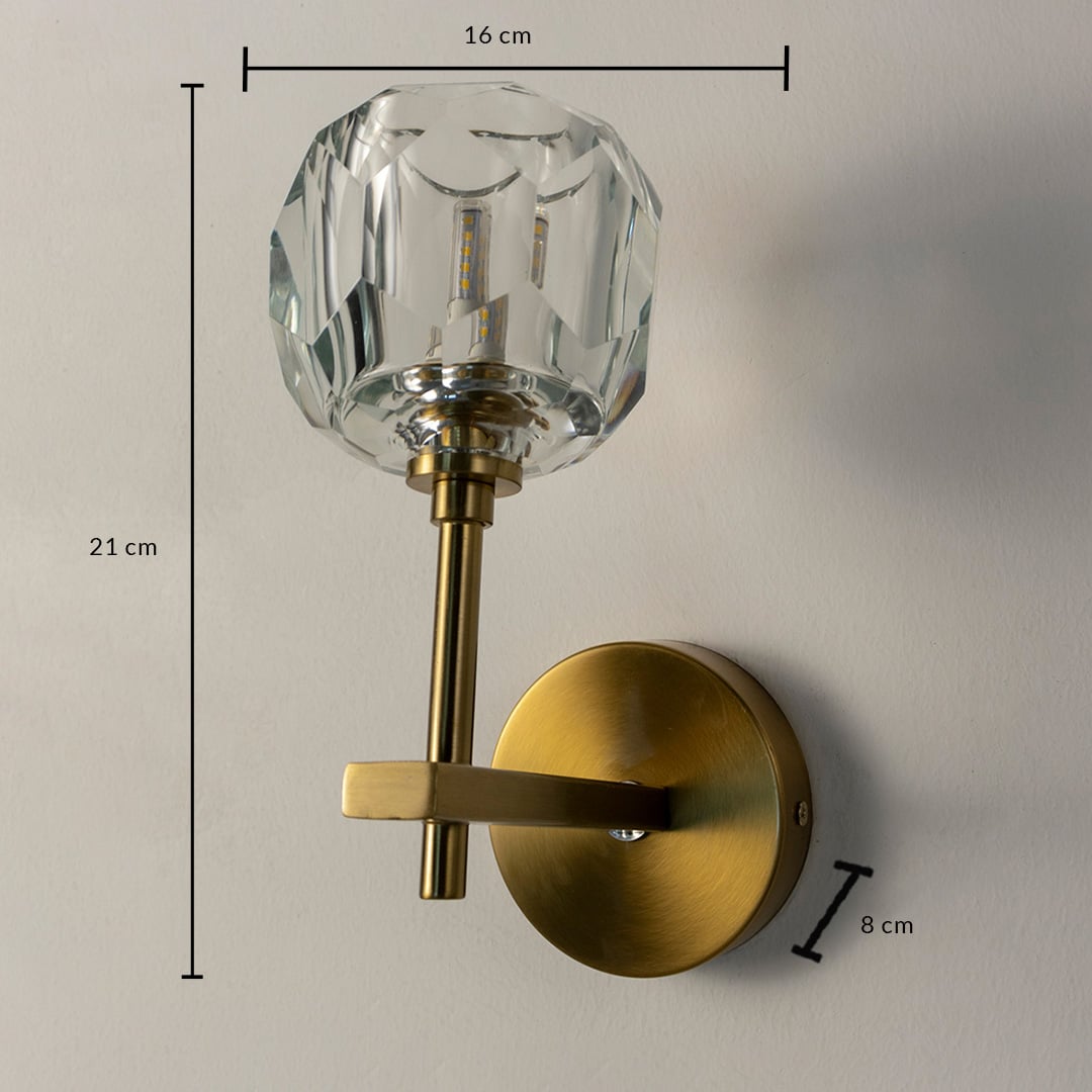 Crystal and brass wall light with 21 cm height and 16 cm width shown with size reference for modern decor.