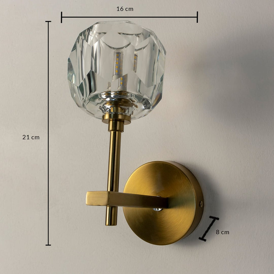 Crystal and brass wall light with 21 cm height and 16 cm width shown with size reference for modern decor.