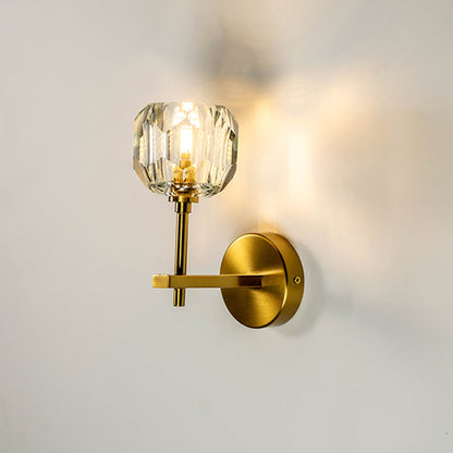 Crystal wall light glowing warmly on white background adding elegance and sophistication to contemporary interiors.