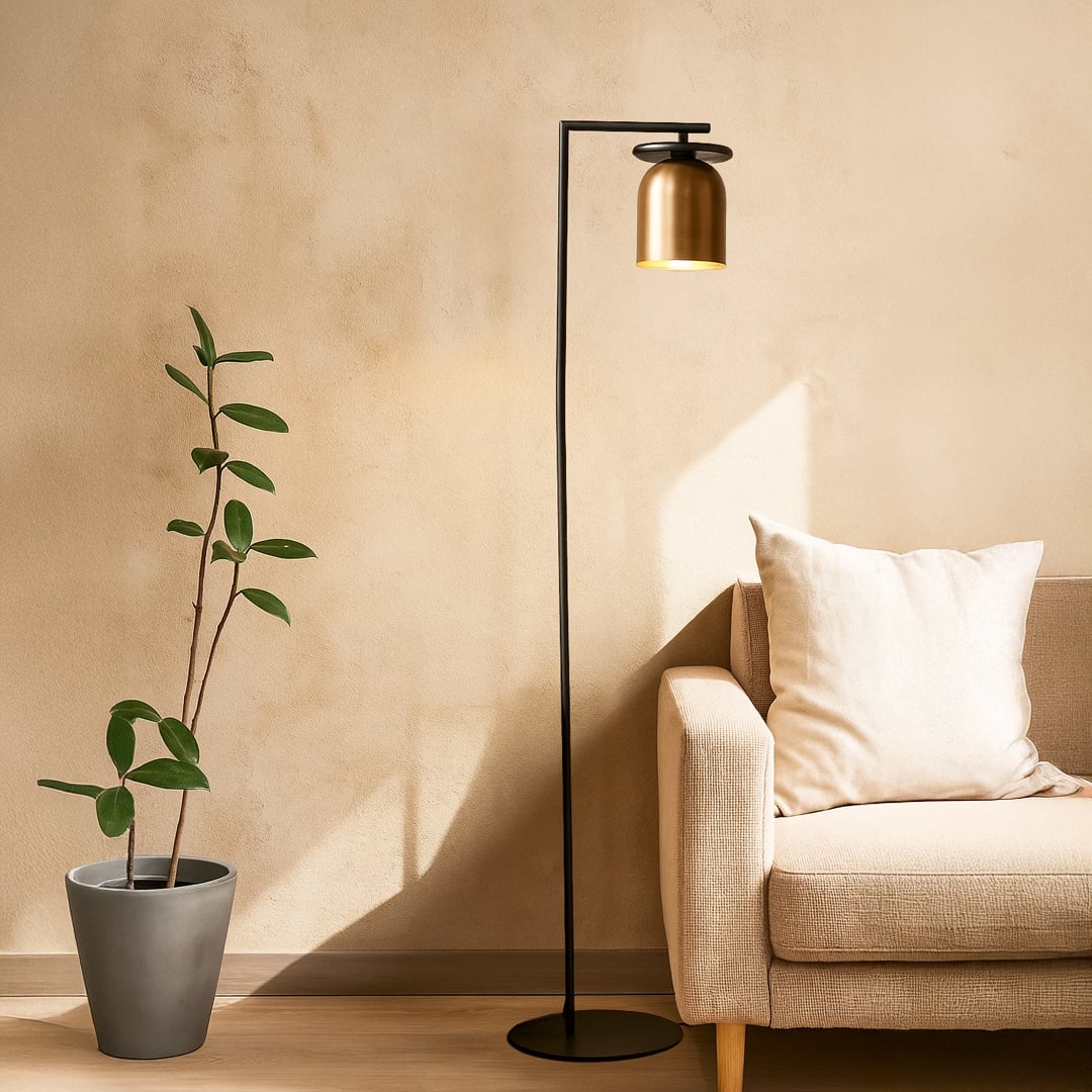 Minimalist floor lamp with black metal stand and gold dome shade shown on white background for product showcase.