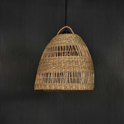 Dome shaped rattan pendant light with handcrafted woven design shown off on black background for rustic home decor.