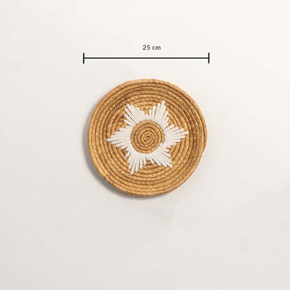 Medium round woven wall basket measuring 27 cm in diameter featuring natural beige coils and white accents displayed on white.