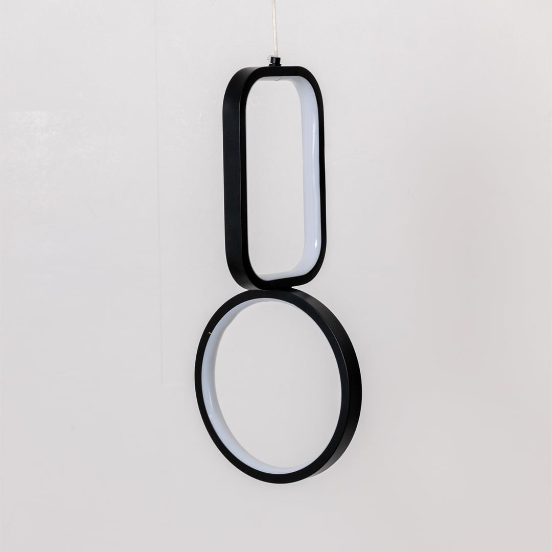Black and white metal dual shape hanging light shown switched off on white background for clean minimal wall decor.
