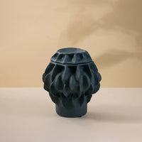 Black ceramic decorative vase with sculptural textured pattern for modern tabletop styling and contemporary home decor.