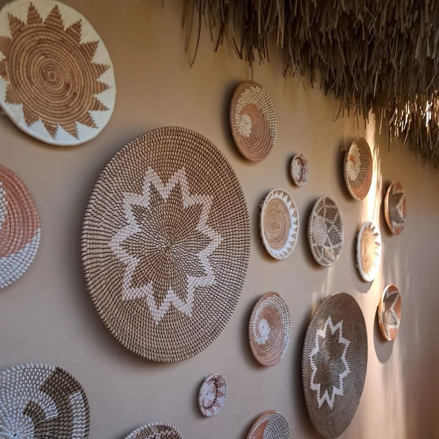 Handwoven wicker basket wall art arranged with natural decor elements for modern minimal and boho home interiors.