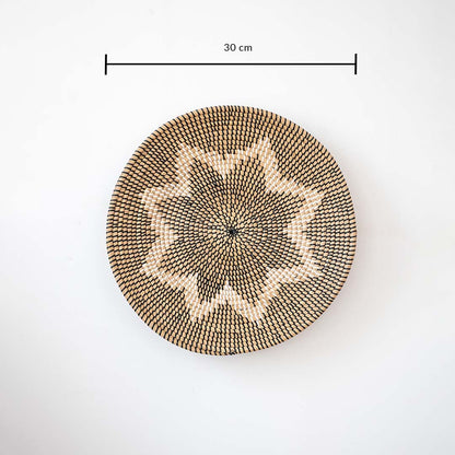 Circular woven wall basket with geometric star motif in natural tones showing 30 cm diameter ideal for accent wall styling.